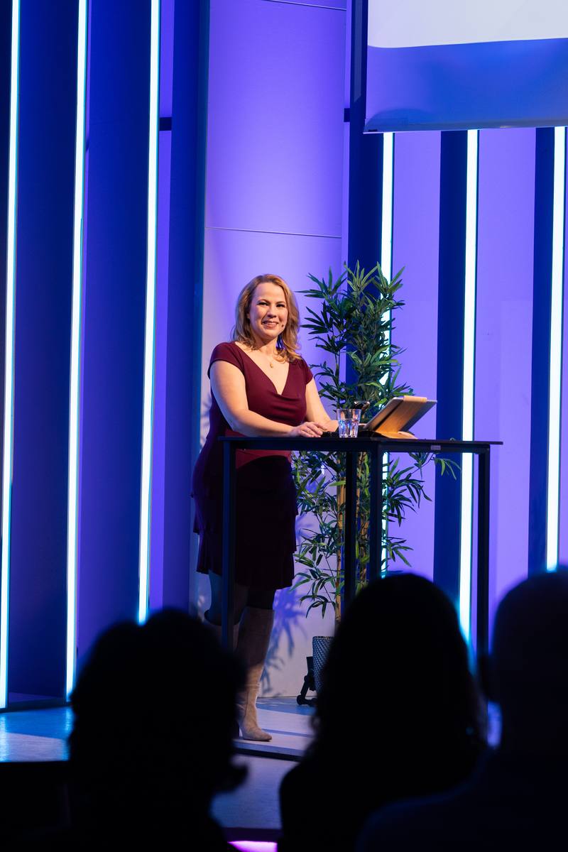 Barbara Zelenay hosting a company event on stage